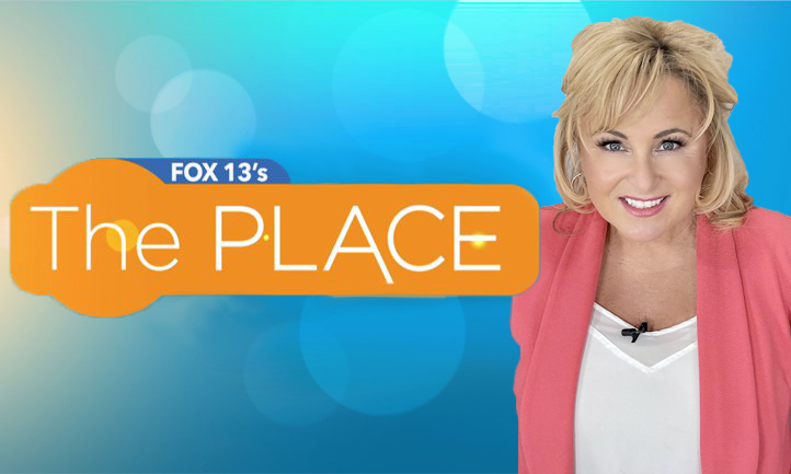 Host of Fox 13's morning show The Place smiling against a blue backdrop.